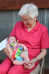 My mom proudly holding one of her many great-grandchildren