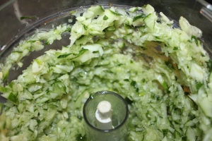 Finely chop cucumbers in the food processor in small batches